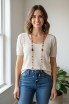 Copper Autumn Cat long necklace from Celtic Crystal Design Jewelry, featuring a detailed cat pendant on a long chain.