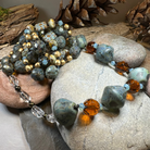 Celtic Crystal Design Jewelry Duneflower Mist long necklace with intricate pendant and delicate chain, elegant and stylish accessory.