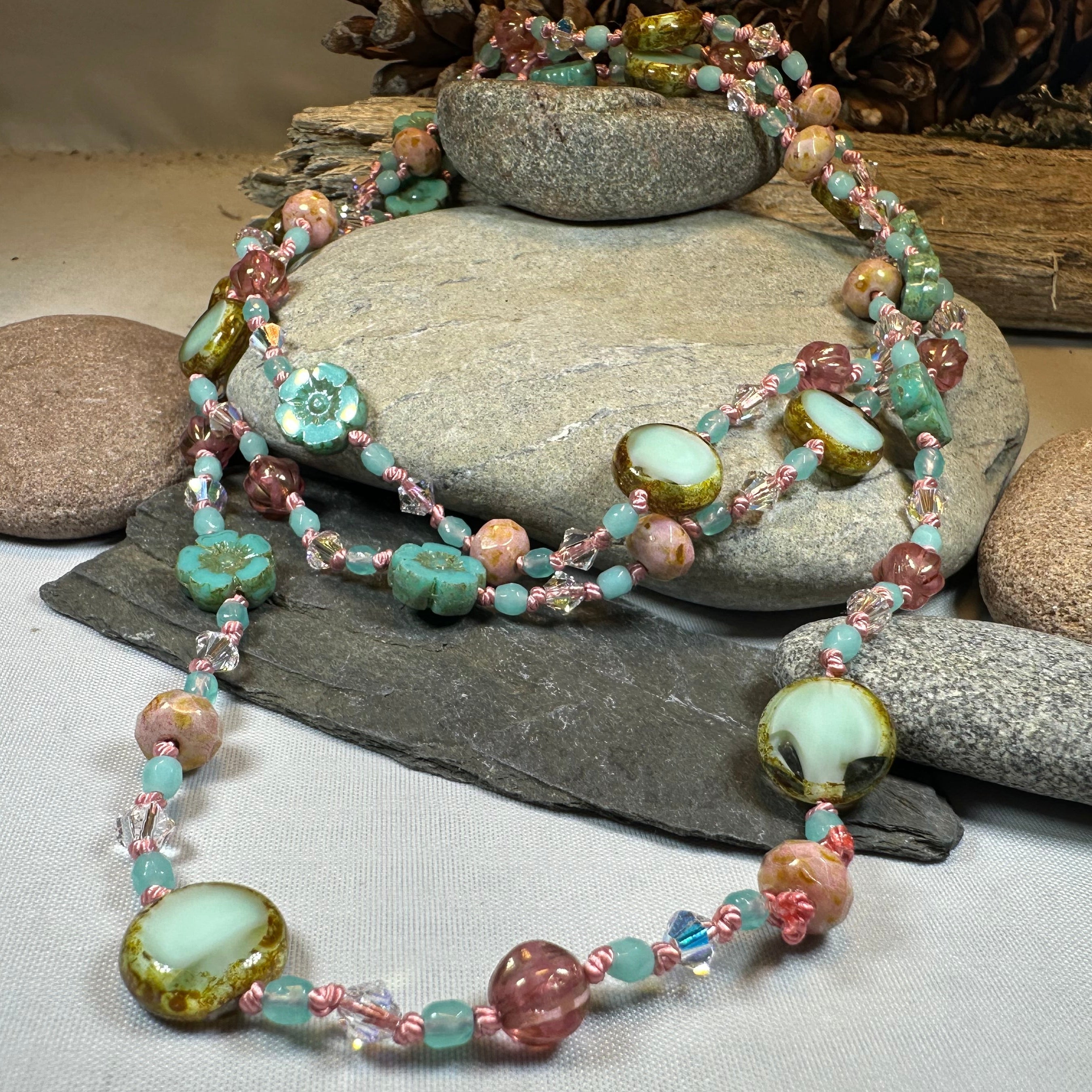 Pink Beach Blossom long necklace by Celtic Crystal Design Jewelry featuring a delicate, colorful beach-themed pendant.