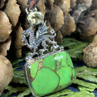 Celtic Crystal Design Jewelry turquoise dragon pendant necklace with blue citrine gemstone on silver chain, detailed craftsmanship.