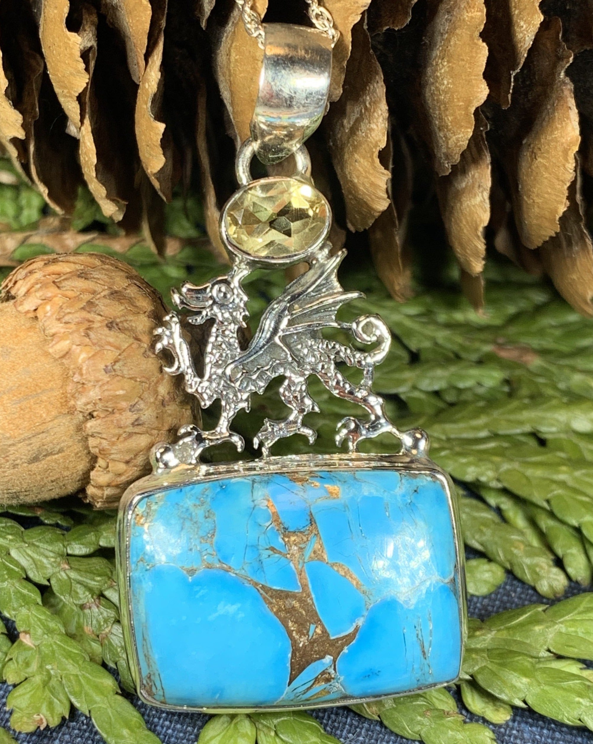 Celtic Crystal Design Jewelry dragon pendant necklace featuring turquoise and blue citrine gemstones, intricate Celtic detailing.