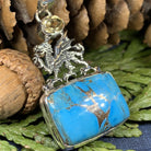 Celtic Crystal Design Jewelry dragon pendant necklace with turquoise and blue citrine stones, featuring intricate Celtic detailing.