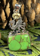 Turquoise dragon pendant necklace by Celtic Crystal Design Jewelry featuring a detailed blue citrine gemstone pendant.