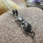Celtic Cat Necklace pendant by Celtic Crystal Design Jewelry, featuring intricate Celtic knot patterns on a silver-tone cat-shaped pendant.