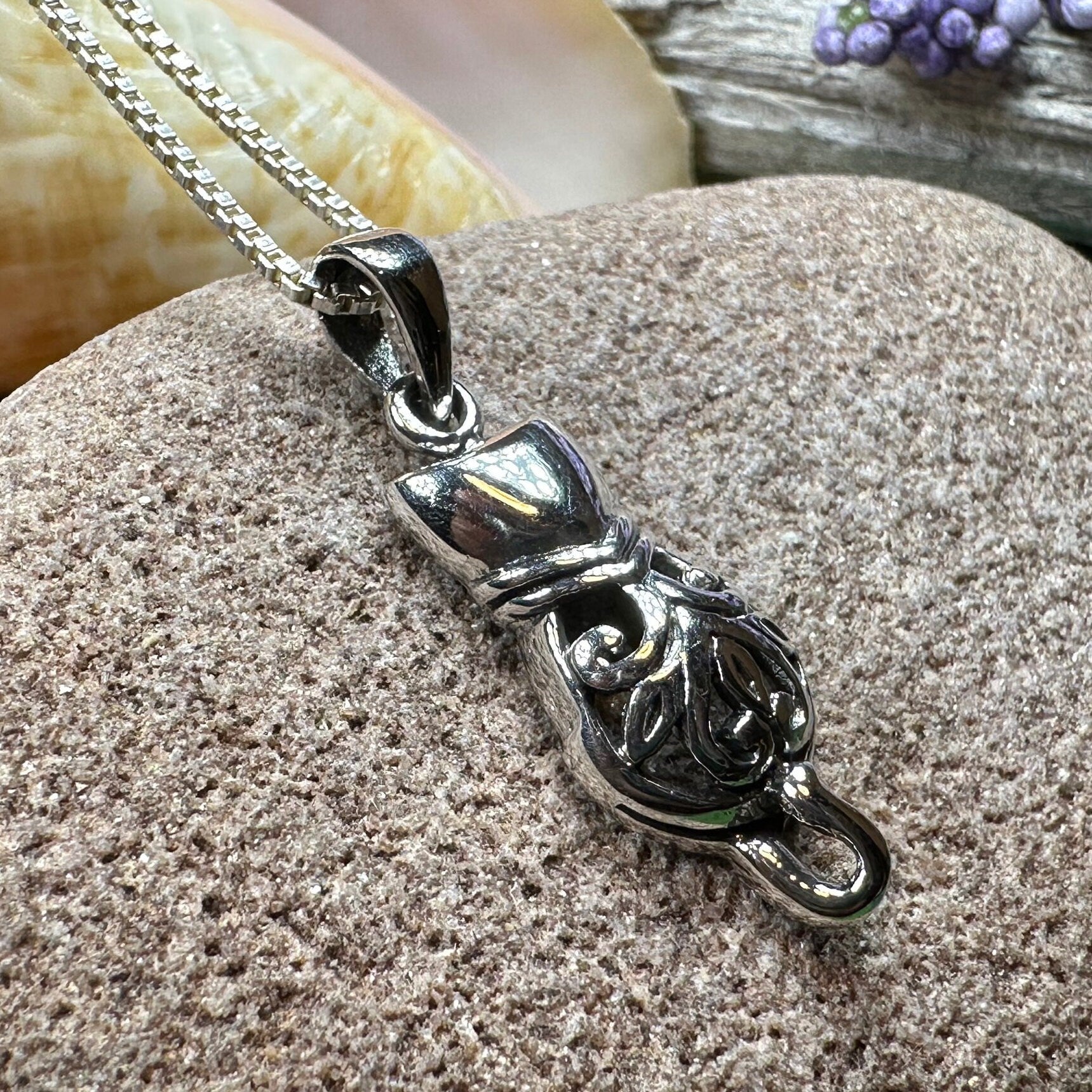 Celtic Cat Necklace pendant by Celtic Crystal Design Jewelry, featuring intricate Celtic knot patterns on a silver-tone cat-shaped pendant.