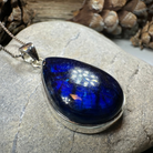 Celtic Crystal Design Jewelry Galaxy Blue Labradorite pendant necklace with intricate Celtic detailing and a large, shimmering labradorite stone