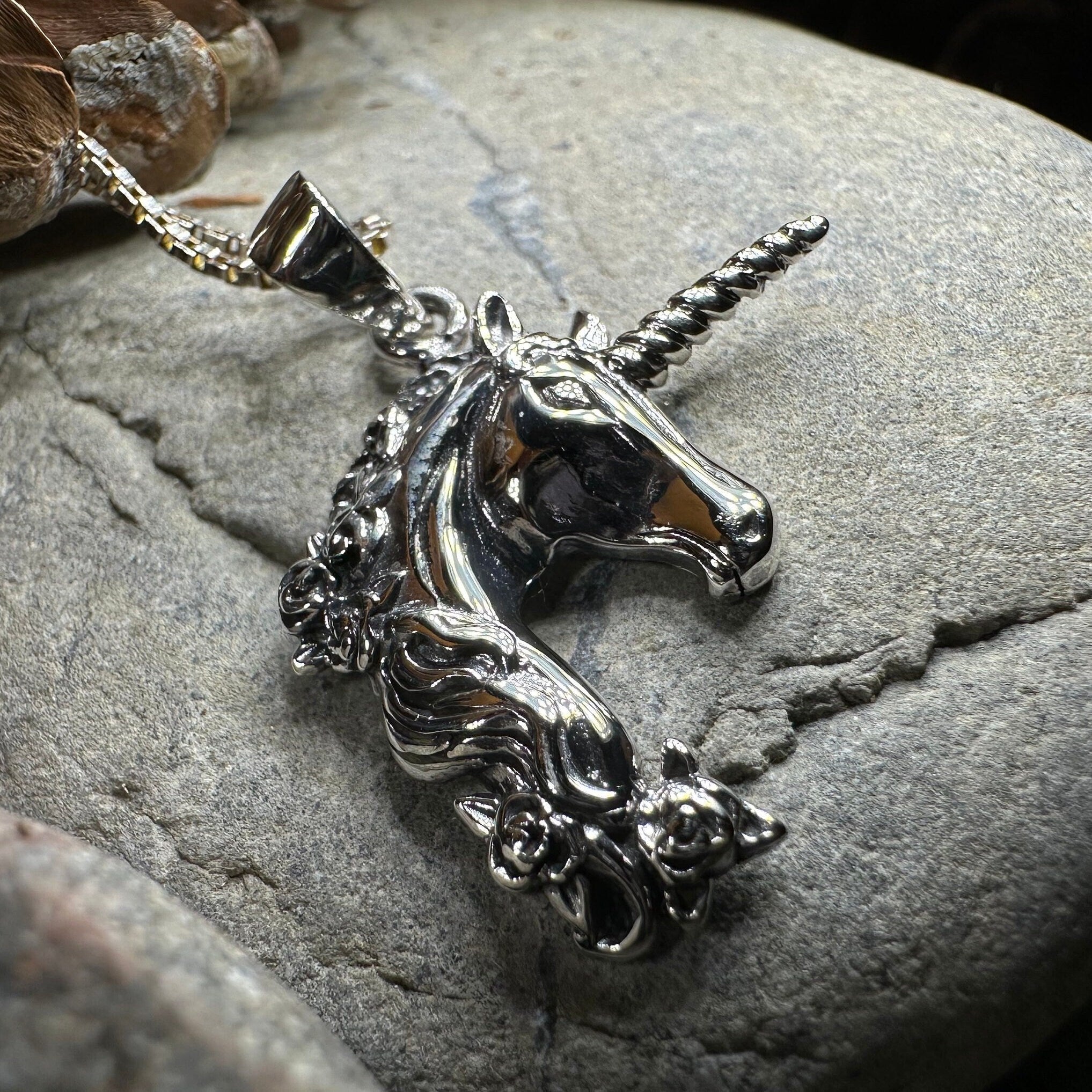 Celtic Crystal Design Jewelry Gwenllian Unicorn Necklace pendant featuring a detailed unicorn design on a silver chain.