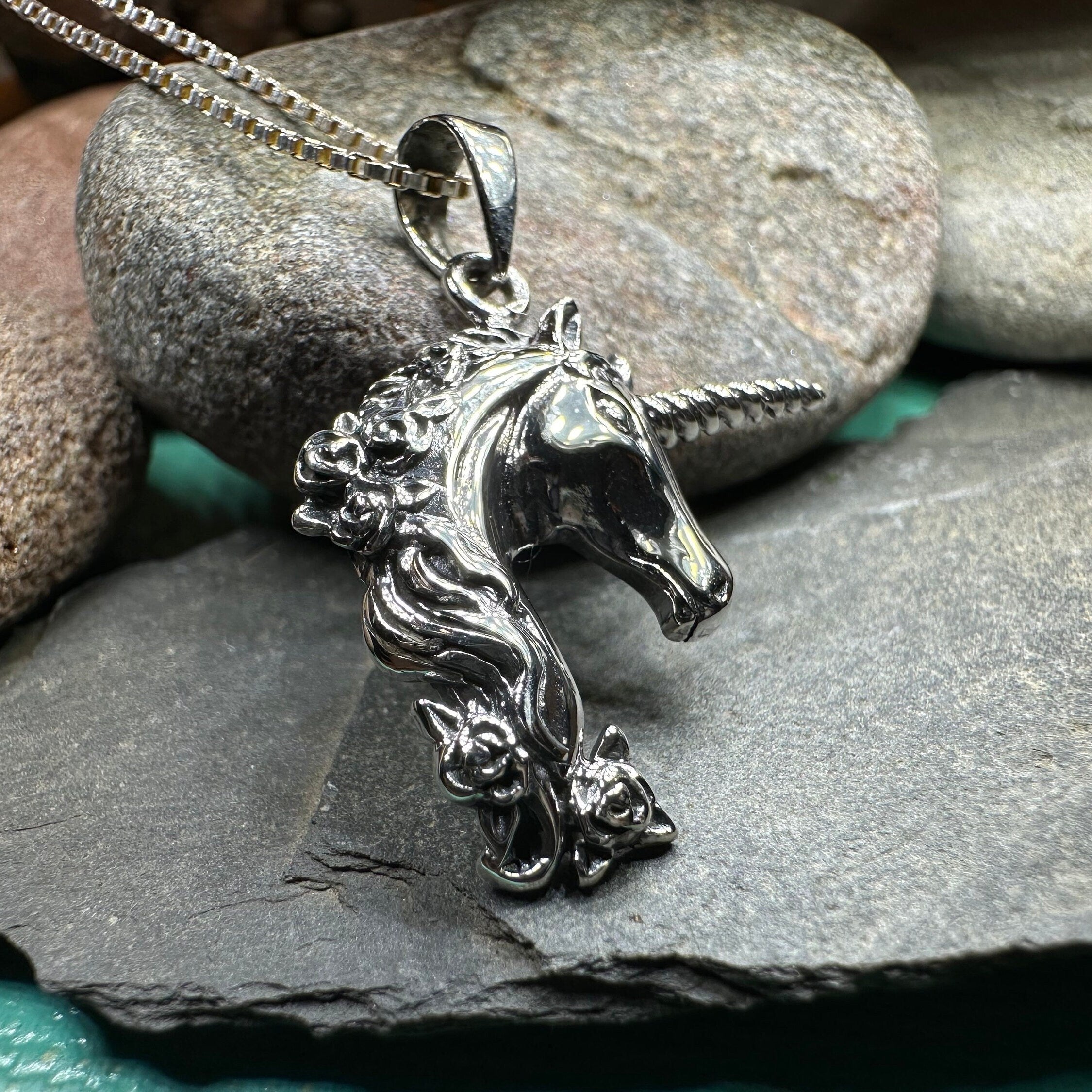 Celtic Crystal Design Jewelry Gwenllian Unicorn Necklace pendant featuring a detailed unicorn charm on a silver chain.