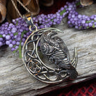 Celtic Raven pendant necklace by Celtic Crystal Design Jewelry featuring intricate Celtic knotwork and a detailed raven motif.