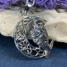 Celtic Raven pendant necklace by Celtic Crystal Design Jewelry featuring intricate Celtic knotwork and a dark, detailed raven design.