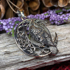 Celtic Raven pendant necklace by Celtic Crystal Design Jewelry featuring intricate Celtic knotwork and dark metal finish.