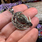 Celtic Raven pendant necklace by Celtic Crystal Design Jewelry featuring intricate Celtic knot patterns and a detailed raven motif.