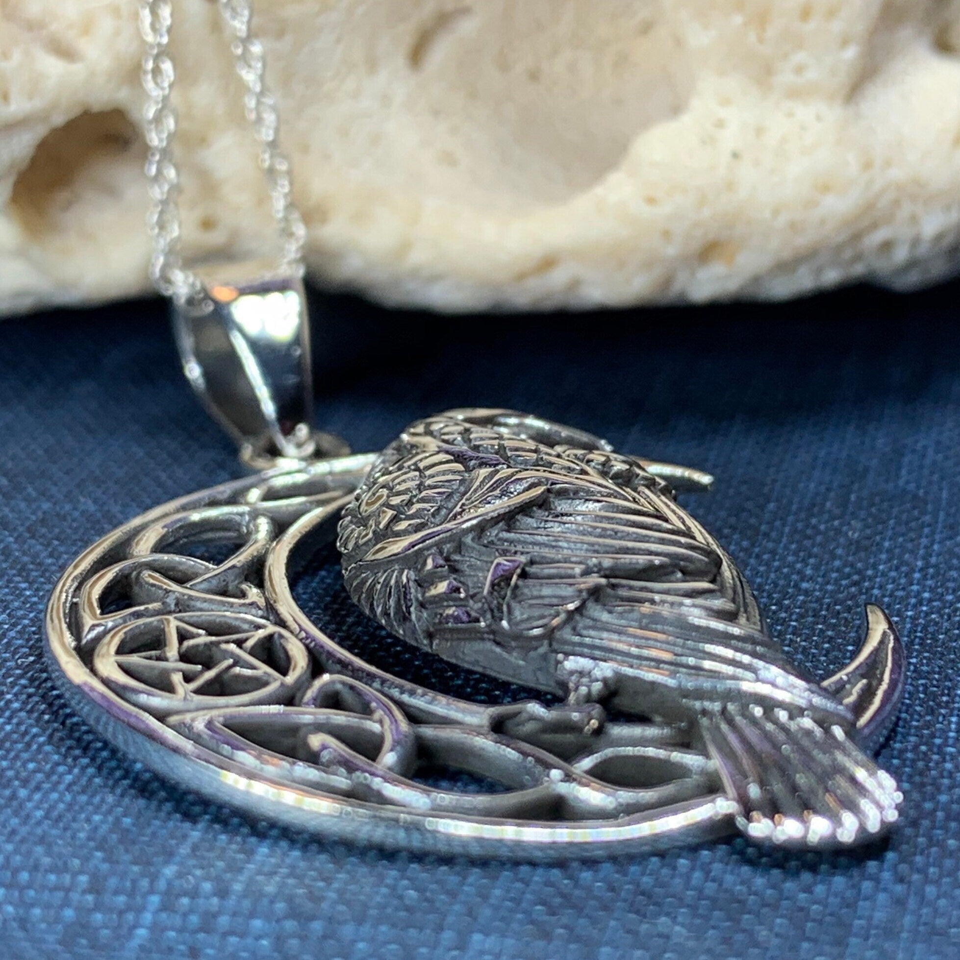 Celtic Raven pendant necklace by Celtic Crystal Design Jewelry featuring intricate Celtic knotwork and a detailed raven design.