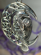 Celtic Raven Pendant necklace by Celtic Crystal Design Jewelry featuring intricate Celtic knotwork and a detailed raven charm.