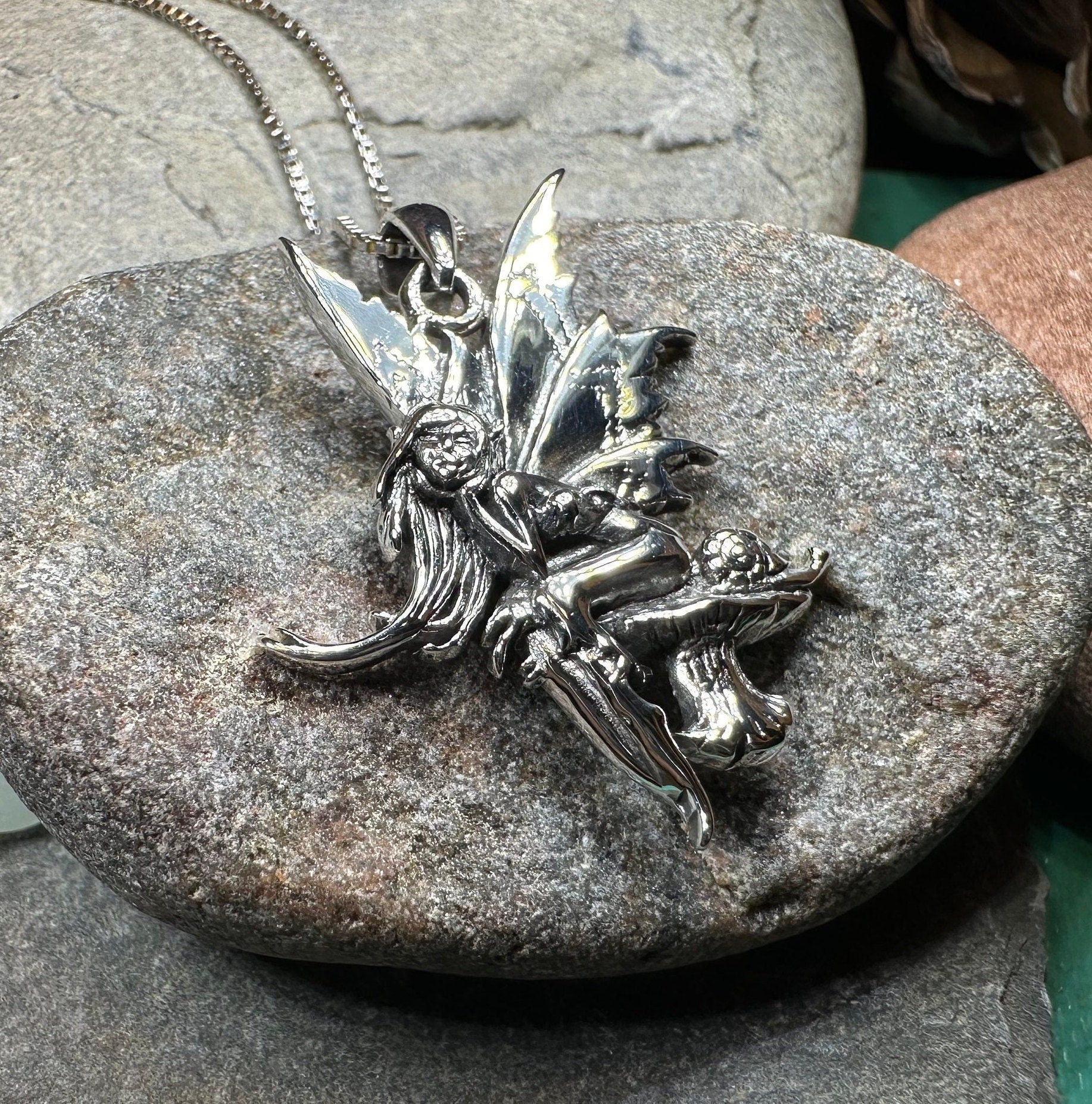 Celtic Crystal Design Jewelry Toadstool Fairy Necklace pendant with intricate fairy and mushroom design on a chain.