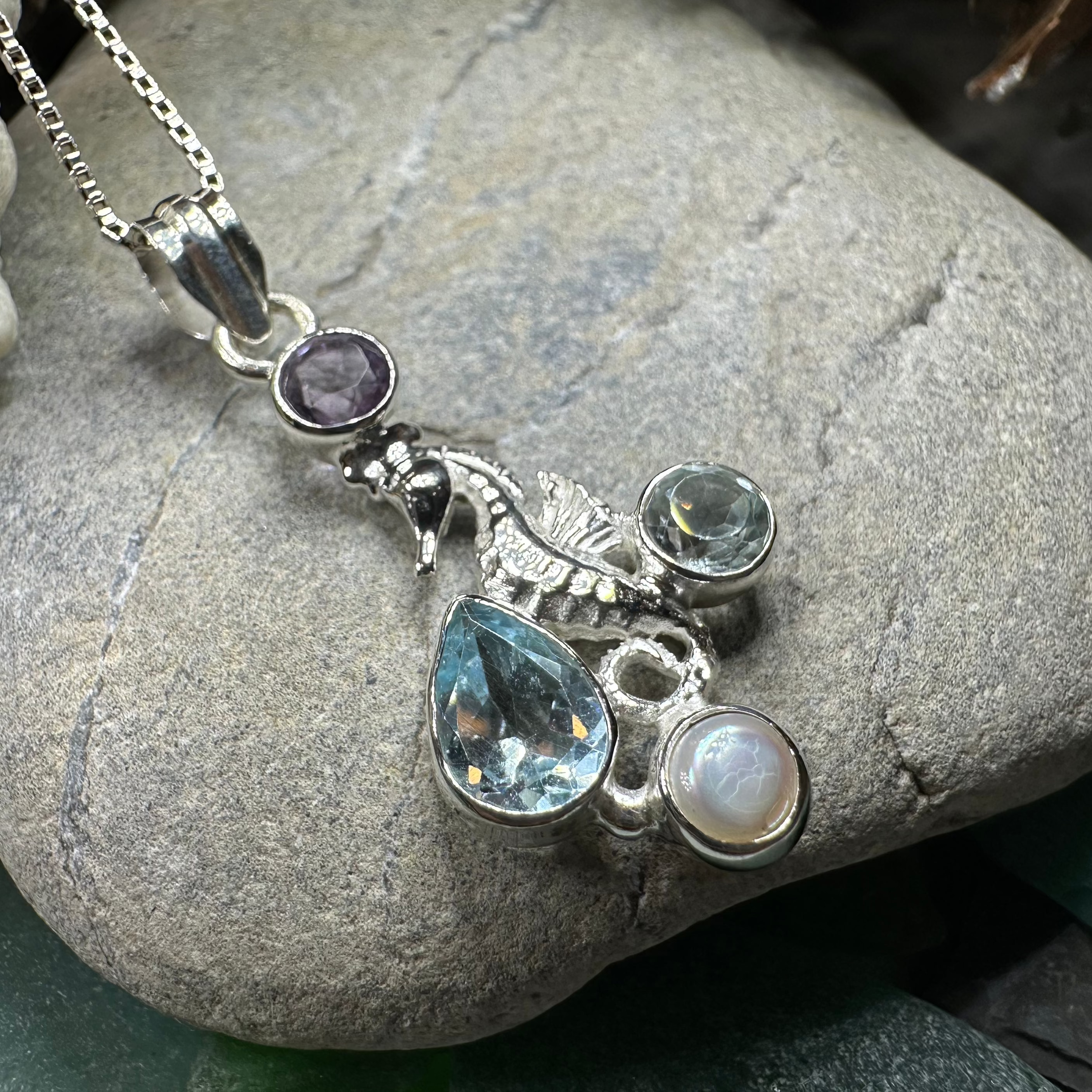 Seamist Seahorse Necklace pendant by Celtic Crystal Design Jewelry featuring topaz and amethyst gemstones in a detailed seahorse design.