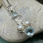 Seamist Seahorse Necklace pendant with topaz and amethyst by Celtic Crystal Design Jewelry, featuring intricate seahorse charm.