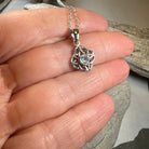 Amethyst Celtic knot pendant necklace by Celtic Crystal Design Jewelry featuring intricate Celtic knot design and purple gemstone.
