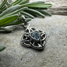 Amethyst Celtic knot pendant necklace by Celtic Crystal Design Jewelry featuring intricate Celtic knot design and purple gemstone.