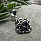 Amethyst Celtic Knot pendant necklace by Celtic Crystal Design Jewelry featuring intricate Celtic knot design and purple gemstone.