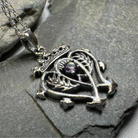 Amethyst Luckenbooth pendant necklace by Celtic Crystal Design Jewelry featuring a detailed Celtic heart-shaped design.
