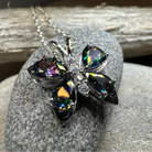 Celtic Crystal Design Jewelry Mystic Topaz Butterfly Pendant necklace with intricate silver detailing and a sparkling topaz gemstone.