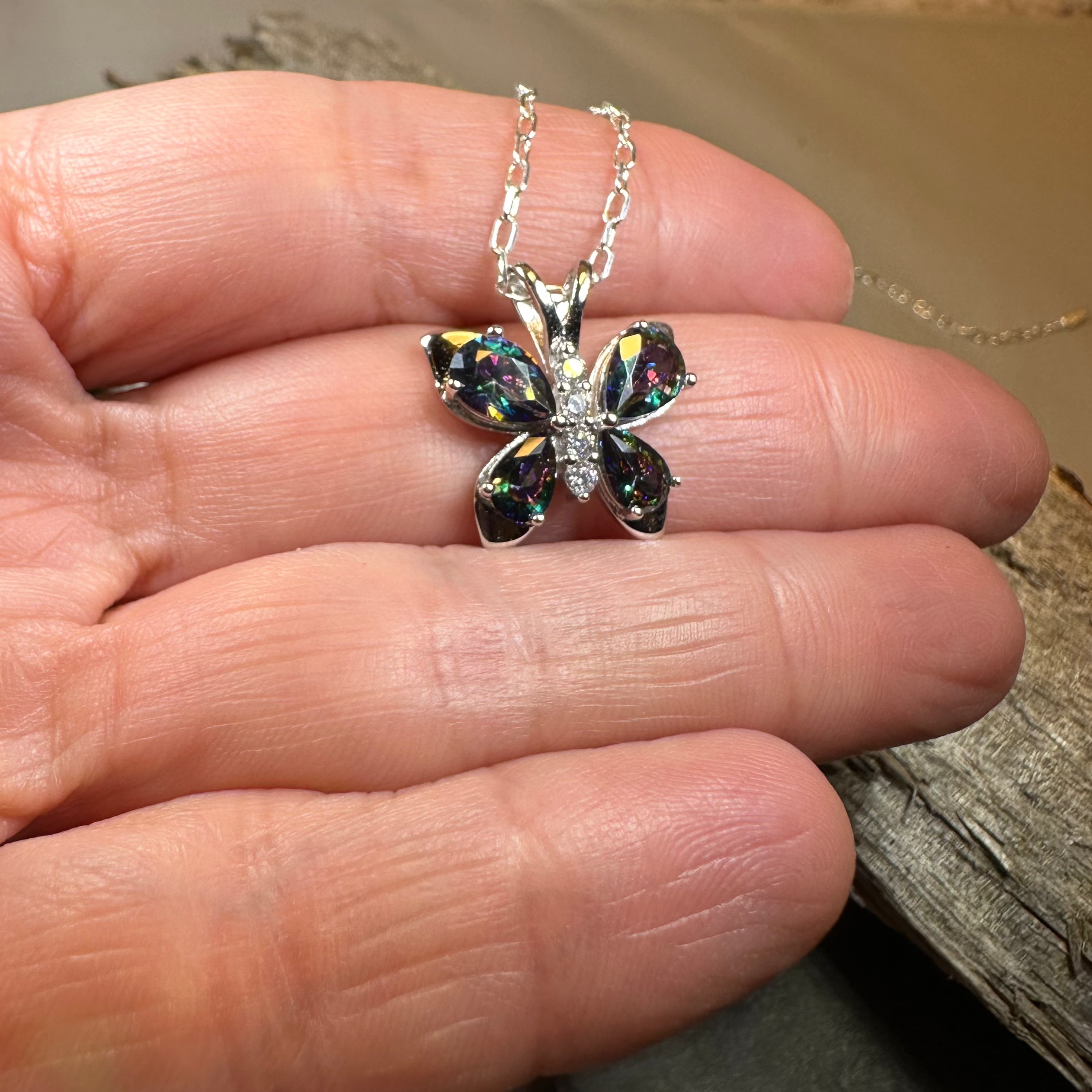 Celtic Crystal Design Jewelry Mystic Topaz Butterfly Pendant necklace with a sparkling topaz gemstone and intricate butterfly design.