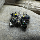 Celtic Crystal Design Jewelry Mystic Topaz butterfly pendant necklace featuring a sparkling gemstone and intricate silver detailing.