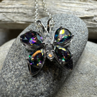 Celtic Crystal Design Jewelry Mystic Topaz Butterfly Pendant necklace featuring a sparkling topaz gemstone butterfly charm.