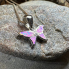 Petite opal butterfly pendant necklace by Celtic Crystal Design Jewelry featuring a pink opal gemstone.