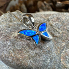 Pink opal butterfly pendant necklace by Celtic Crystal Design Jewelry, featuring a petite butterfly-shaped gemstone pendant.