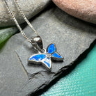 Petite pink opal butterfly pendant necklace by Celtic Crystal Design Jewelry, featuring a delicate and colorful gemstone charm.