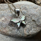 Pink opal butterfly pendant necklace by Celtic Crystal Design Jewelry, featuring a delicate petite butterfly pendant.