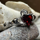 Garnet Claddagh ring by Celtic Crystal Design Jewelry featuring a heart and crown design with red garnet gemstone.
