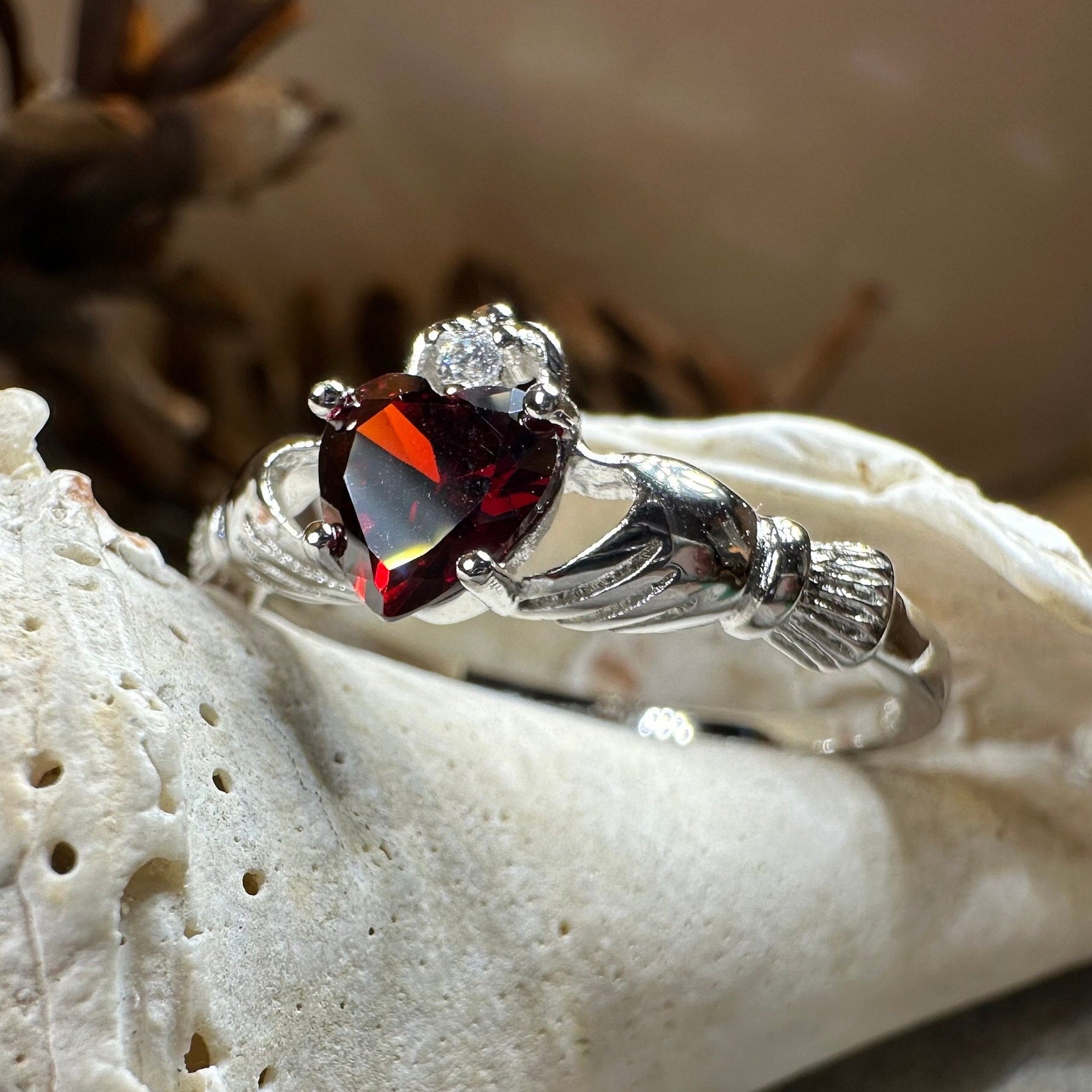 Celtic Crystal Design Jewelry Garnet Claddagh Ring featuring a heart-shaped garnet gemstone and traditional Celtic design.