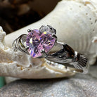 Petal pink Claddagh ring by Celtic Crystal Design Jewelry featuring light pink gemstone and intricate Celtic detailing.
