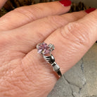 Petal pink Claddagh ring by Celtic Crystal Design Jewelry, featuring intricate Celtic motifs and a delicate pink gemstone accent.