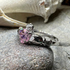 Petal pink Claddagh ring by Celtic Crystal Design Jewelry featuring intricate Celtic detailing and a delicate light pink gemstone.