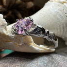 Petal pink Claddagh ring by Celtic Crystal Design Jewelry featuring a delicate heart and crown design in light pink.