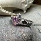Petal pink Claddagh ring by Celtic Crystal Design Jewelry showing intricate Celtic design and light pink gemstone details.