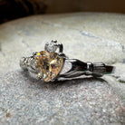 Champagne Toast Claddagh ring by Celtic Crystal Design Jewelry featuring a gold-tone band and intricate Celtic knot details.