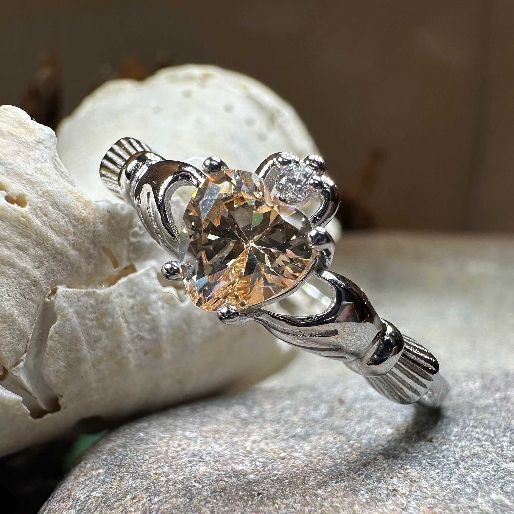 Celtic Crystal Design Jewelry Champagne Toast Claddagh Ring with detailed Celtic knotwork and sparkling crystal accents.