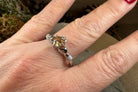 Celtic Crystal Design Jewelry Champagne Toast Claddagh Ring with intricate Celtic knot details and a champagne-colored gemstone.