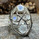 Celtic Crystal Design Jewelry moonstone infinity ring with intricate Celtic pattern and shimmering moonstone centerpiece.