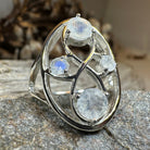 Celtic Crystal Design Jewelry moonstone infinity ring featuring a polished moonstone gemstone and intricate Celtic-inspired band.