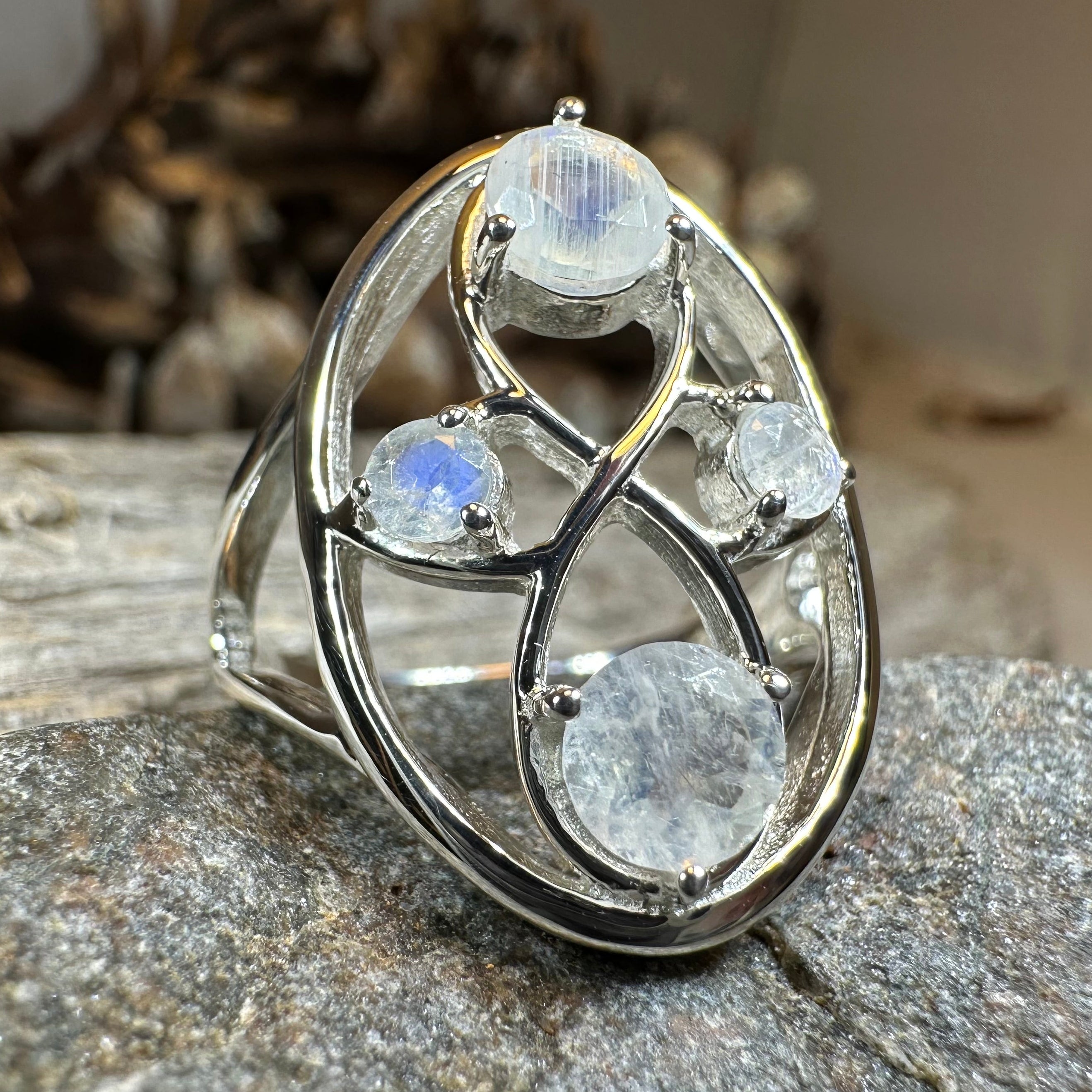 Celtic Crystal Design Jewelry moonstone infinity ring featuring a polished moonstone gemstone and intricate Celtic-inspired band.