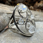 Celtic Crystal Design Jewelry moonstone infinity ring featuring a polished moonstone gemstone and intricate Celtic detailing.