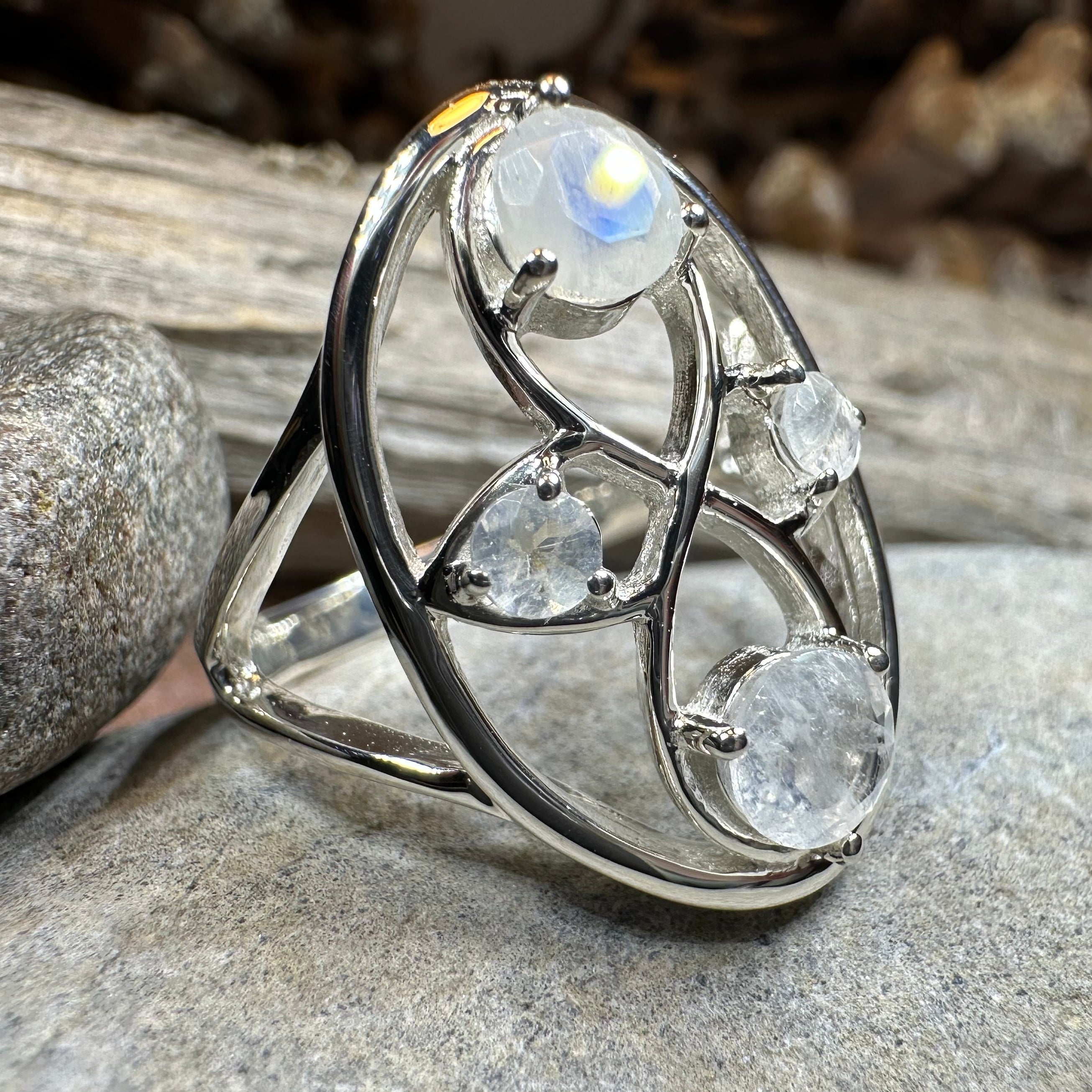 Celtic Crystal Design Jewelry moonstone infinity ring featuring a polished moonstone gemstone and intricate Celtic detailing.