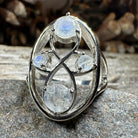 Celtic Crystal Design Jewelry moonstone infinity ring with intricate Celtic pattern and polished moonstone gemstone.