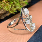 Celtic Crystal Design Jewelry moonstone infinity ring with intricate Celtic patterns and a smooth, polished moonstone centerpiece.